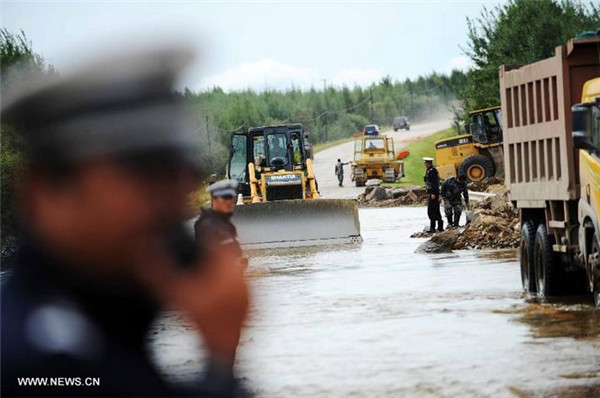 Floods cut off roads in NE China's county