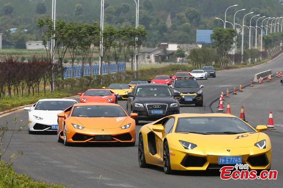 High-end sports cars rally in ancient town