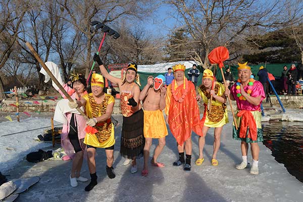 Winter swim enthusiasts celebrate the Year of the Monkey