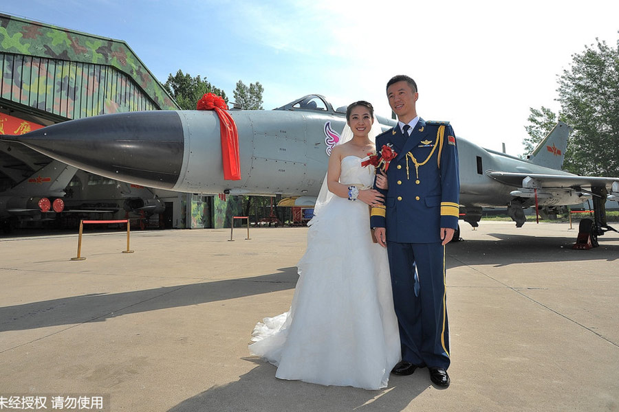 Military-style wedding: Fighter jets, grooms in dashing uniforms