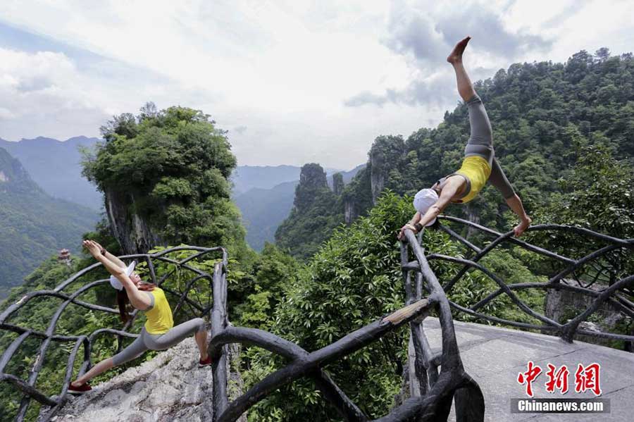 Yoga performance on cliff road in C China