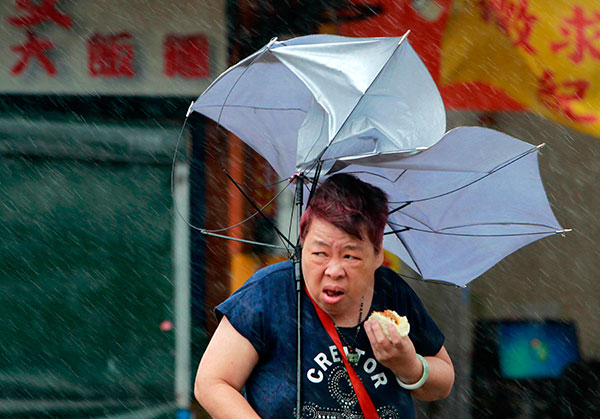 China shuts schools and recalls fishing boats as typhoon hits