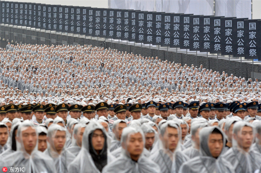 Thousands pay tribute to victims of Nanjing Massacre