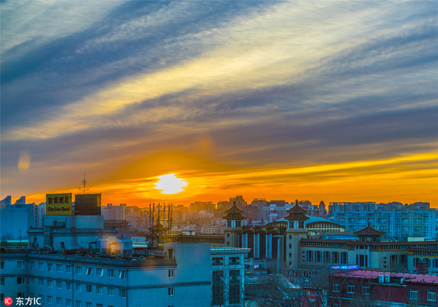 Beijing wakes to rosy dawn