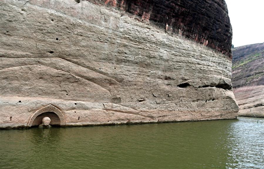 Ancient Buddha found as water level of reservoir lowers in E China