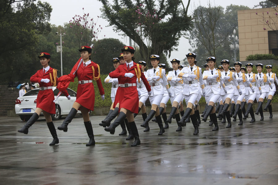 Female college students form flag-raising team