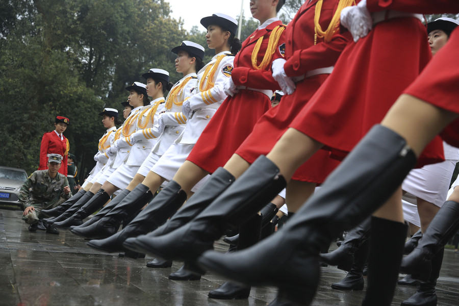 Female college students form flag-raising team