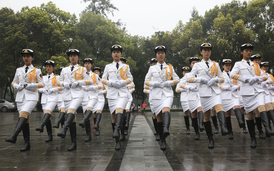 Female college students form flag-raising team