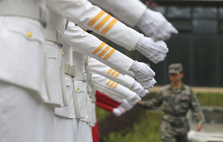 Female college students form flag-raising team