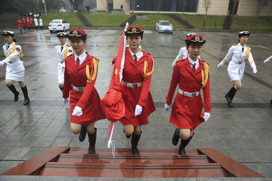 Female college students form flag-raising team