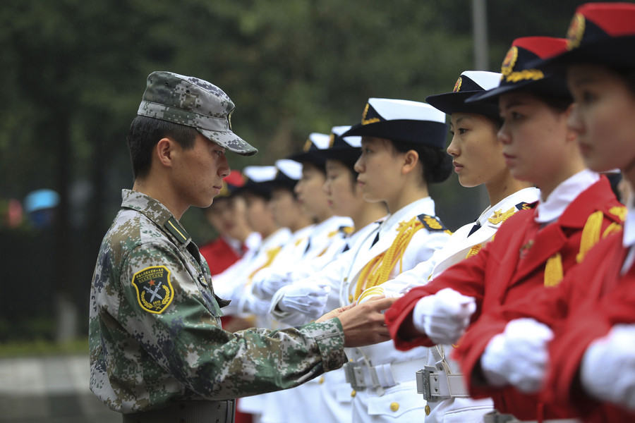 Female college students form flag-raising team