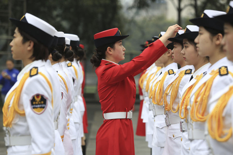 Female college students form flag-raising team