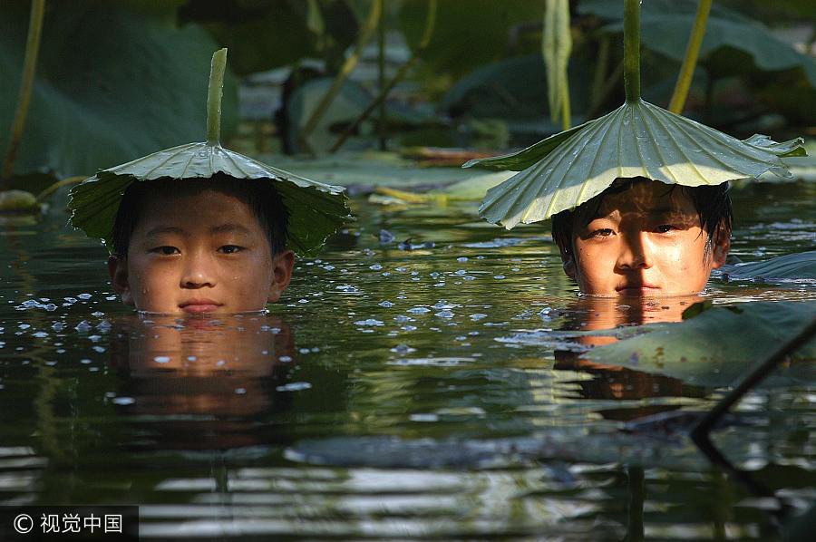 Anything goes as a hat in China's hot summers