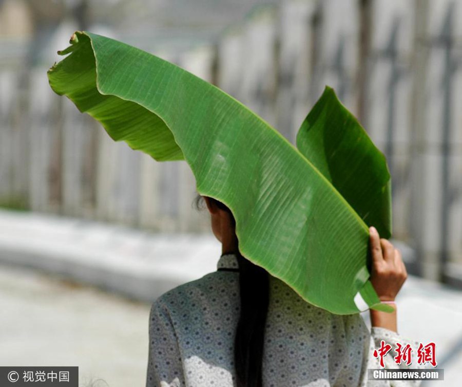 Anything goes as a hat in China's hot summers