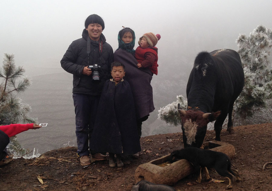 Young photographer takes family photos for mountain-dwellers