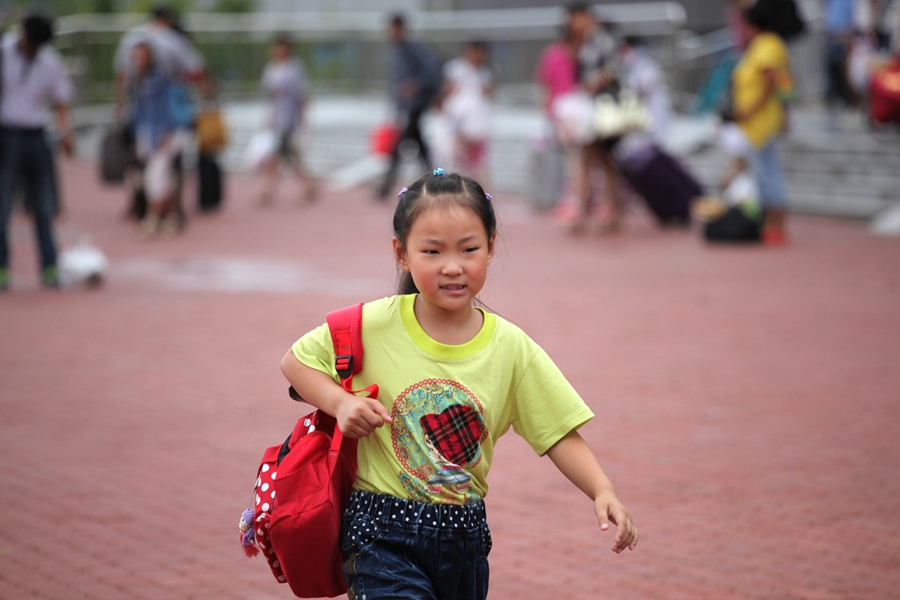 Goodbyes and tears as left-behind children head home