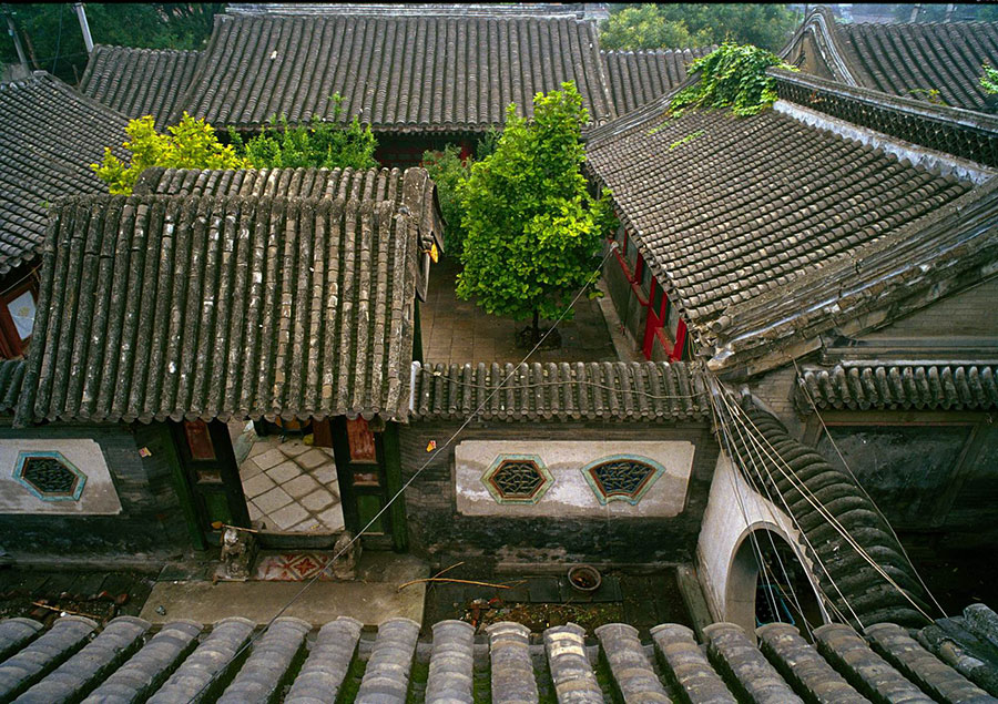 Photo exhibition narrates charm of old Beijing