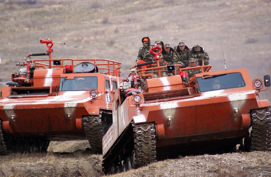 Tanks tackle wildfires in NE China