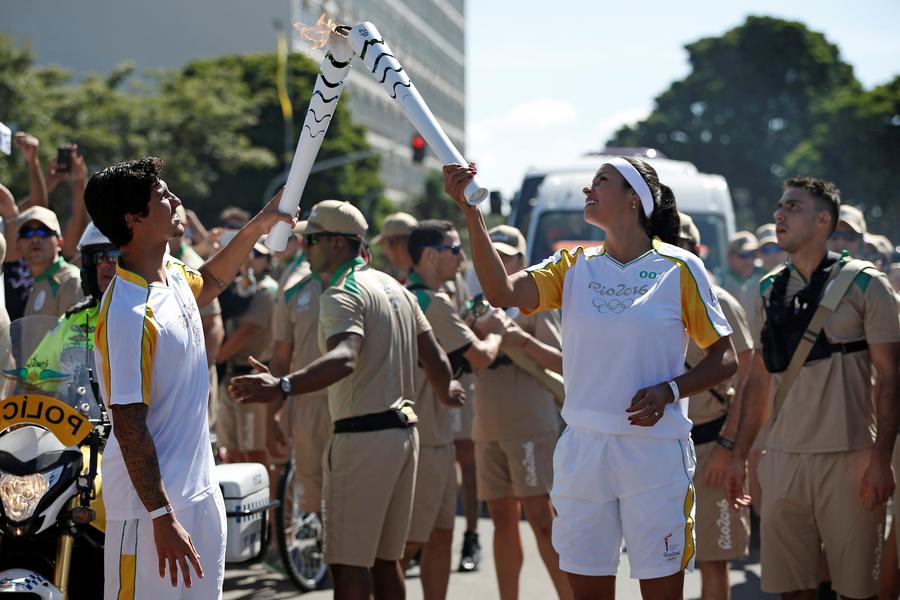 Olympic Flame lands in Brazil for 94-day relay to Games