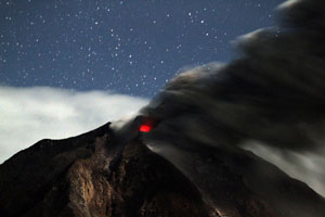 People clear volcano ash in Indonesia