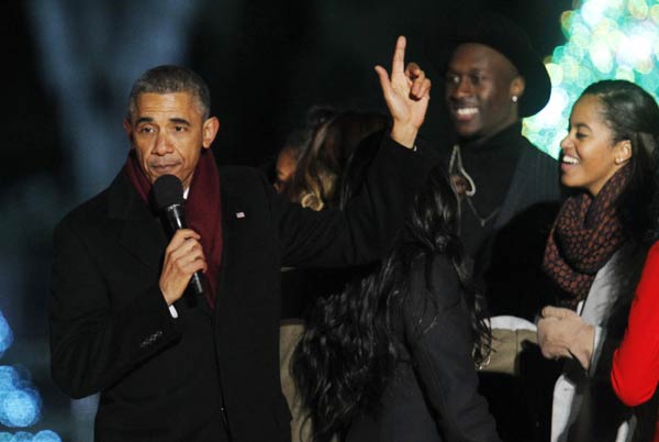 Obamas usher in Christmas with lighting of national tree