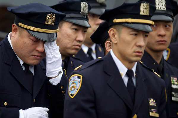 Thousands see off slain police officer