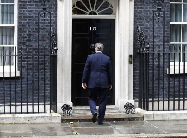 UK's Cameron hums merry tune after announcing PM handover moves