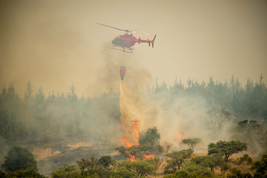 Chile battles devastating wildfires as international help pours in