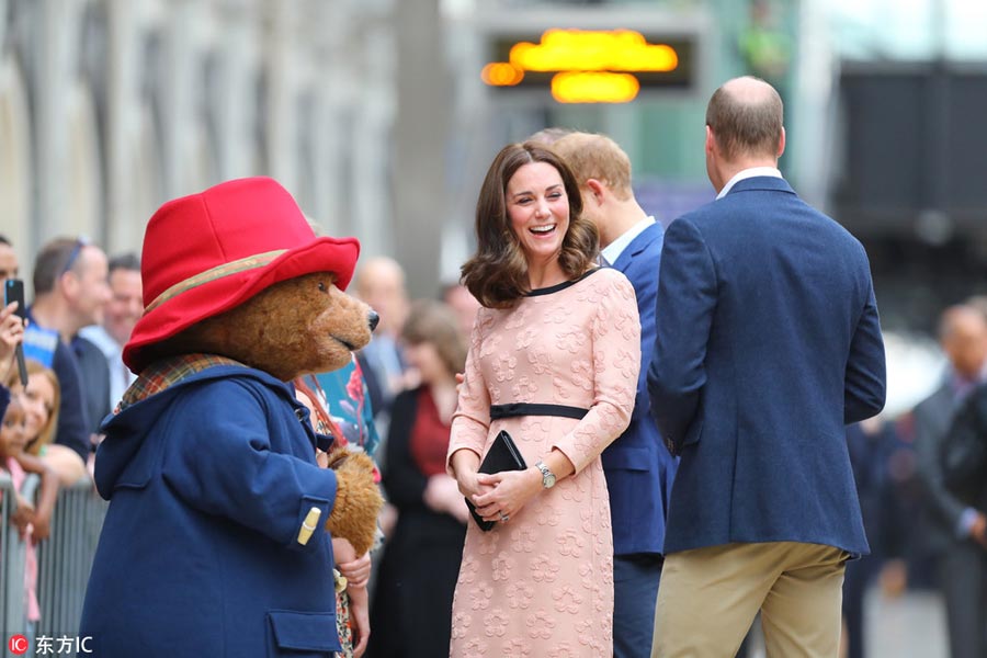 Pregnant Kate dances with Paddington Bear